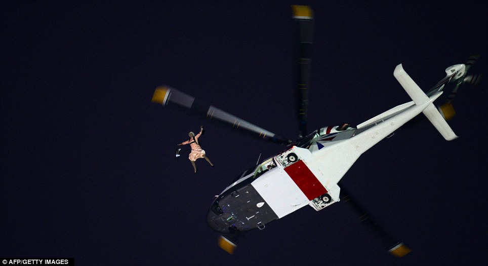 The Queen hurtling out of the helicopter...
