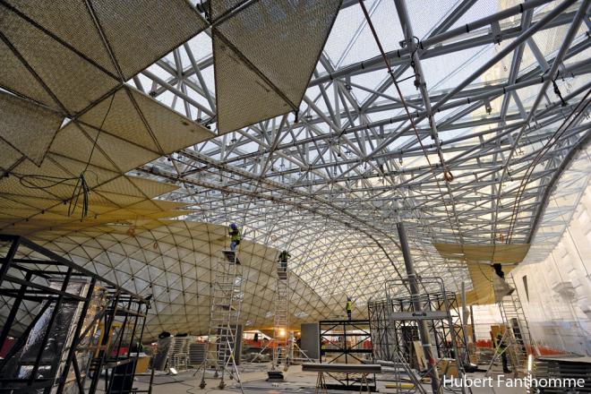 The structure of the floating golden roof of the Louvre's Islamic Art Department...